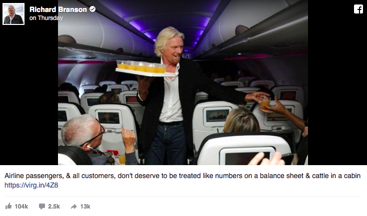 Richard Branson's Facebook post of him serving drinks to his passengers. 